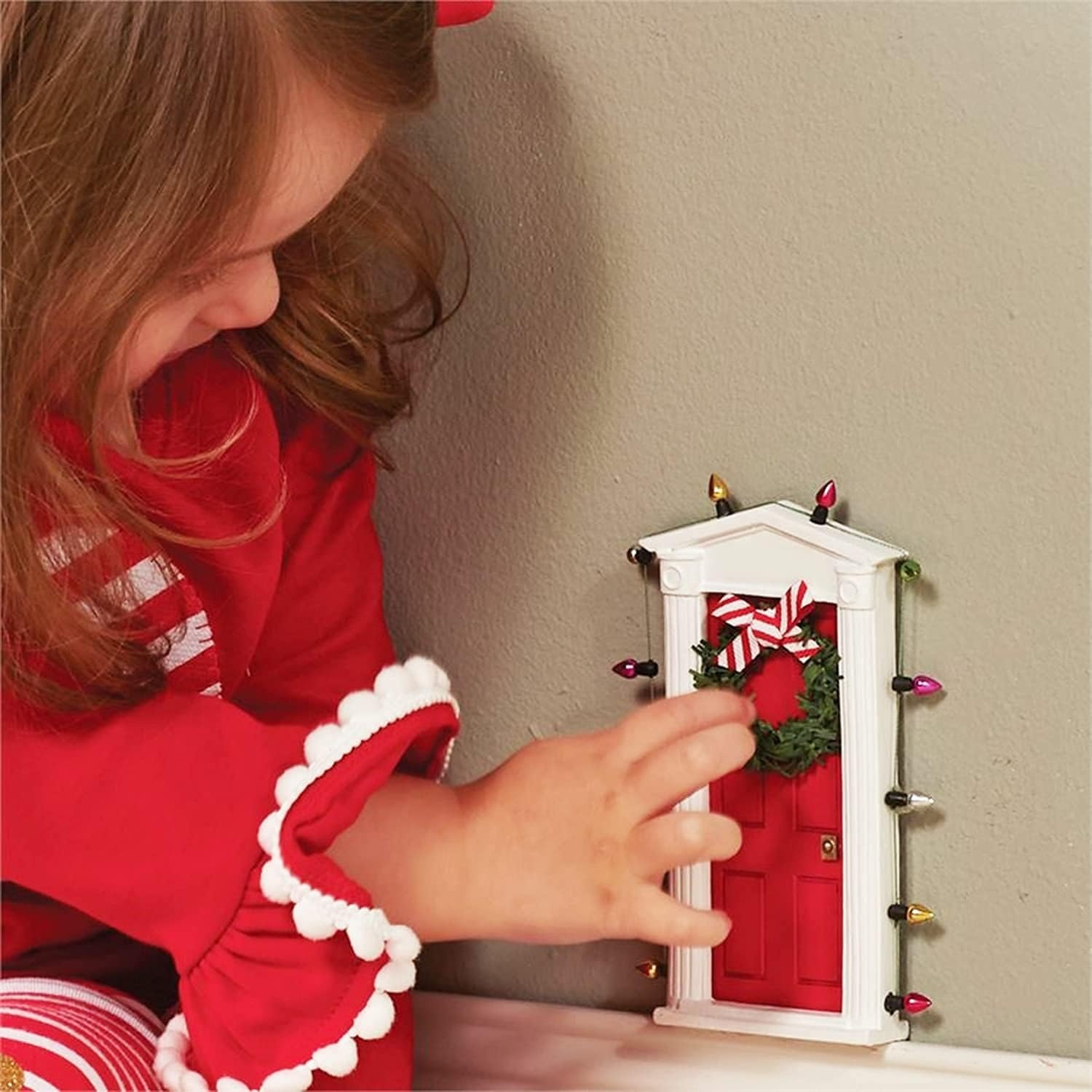 image:imageStanding miniature dimensional door surrounded with lights and tiny faux wreath with bow allows special entry for fairies and elves